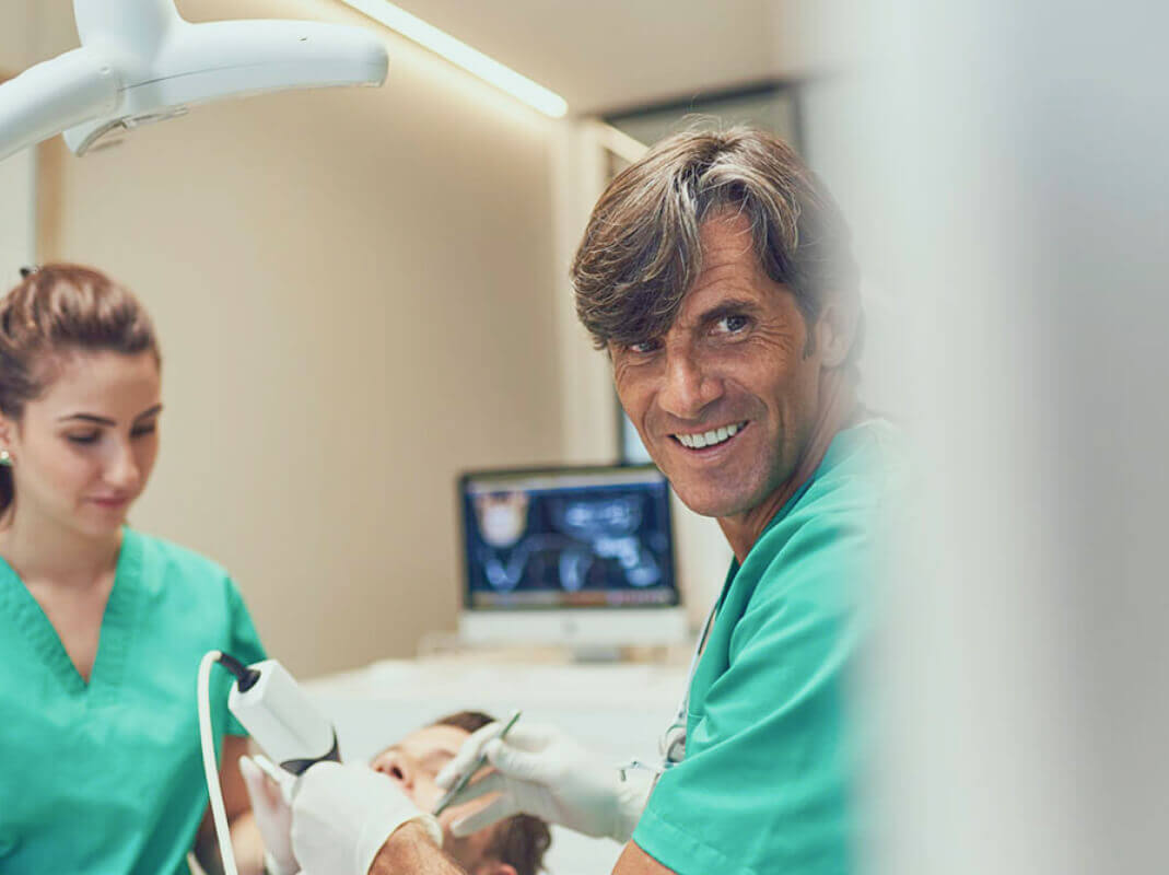 Image with heavy digital distortion and horizontal colored lines obscuring most details, making it difficult to identify any specific objects or subjects in the picture.